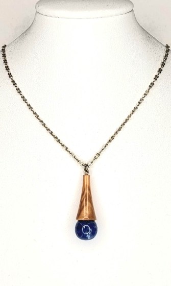 Wonderful Pendant made of olive wood and liquid glass in blue color with silver flakes